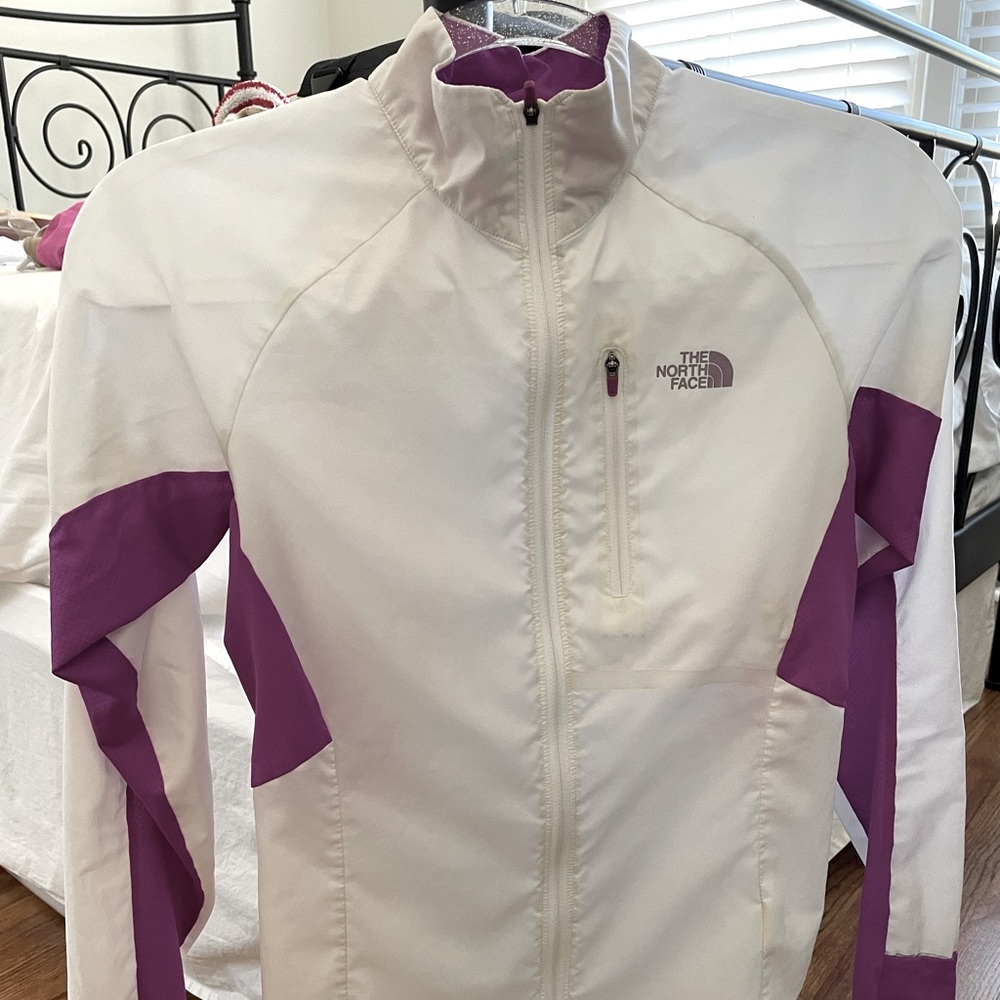 Cute North Face zip up jacket/windbreaker. Very lightweight. Great condition.